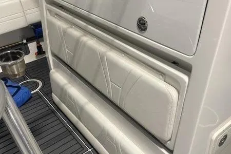 Slide: The Image of 2022 Prowler 31 boat with sleek design and modern features, docked outdoors. - 14