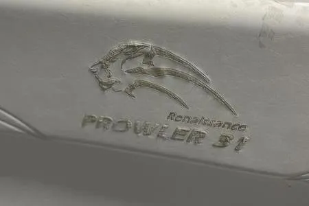 Slide: The Image of 2022 Prowler 31 boat with Mercury outboard motor and ladder on trailer. - 23