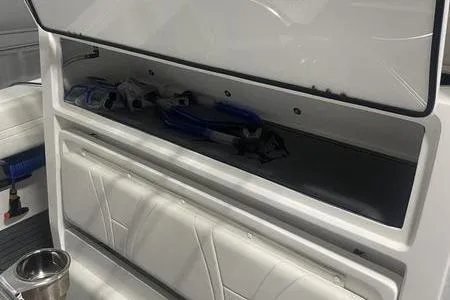 Slide: The Image of 2022 Prowler 31 boat interior with white seating and sleek design. - 25
