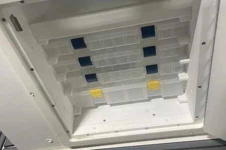 Slide: The Image of Battery compartment of 2022 Prowler 31 with multiple batteries and red cables. - 27