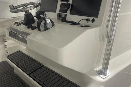 Slide: The Image of 2022 Prowler 31 boat with Mercury outboard motor and ladder on trailer. - 28