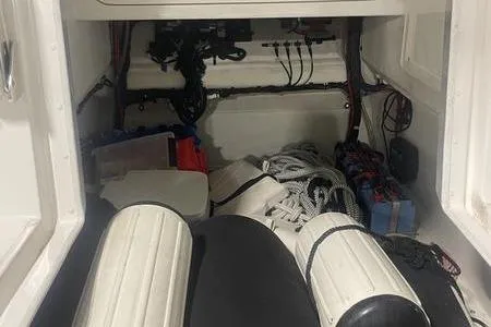 Slide: The Image of Storage compartment of 2022 Prowler 31 boat with ropes and equipment. - 7