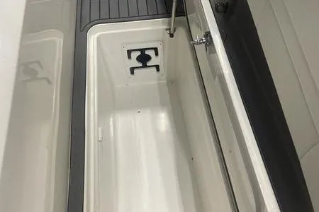 Slide: The Image of 2022 Prowler 31 boat dashboard with steering wheel and electronic controls. - 9