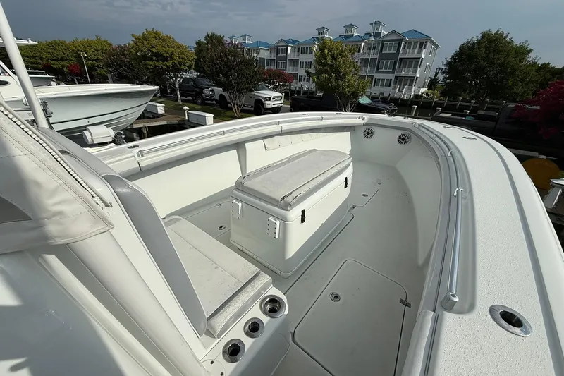 Slide: The Image of 2021 Yellowfin 36 Offshore boat interior with seating and storage, docked at marina. - 11
