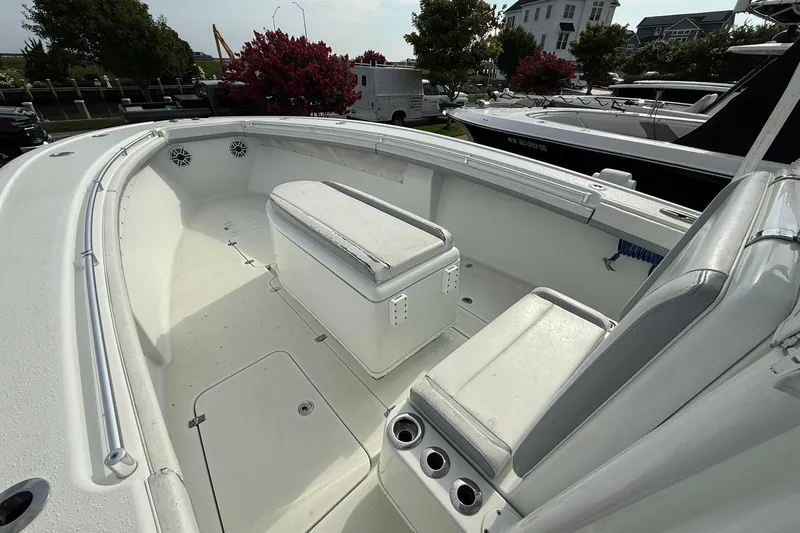 Slide: The Image of 2021 Yellowfin 36 Offshore boat dashboard with Simrad and Garmin navigation systems. - 17