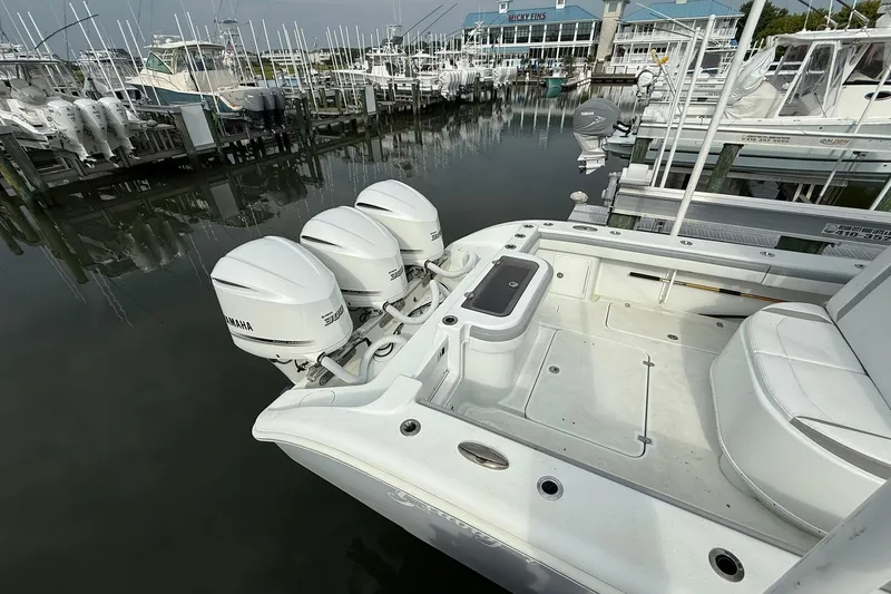 Slide: The Image of 2021 Yellowfin 36 Offshore boat compartment with visible pumps and wiring. - 19