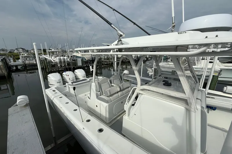 Slide: The Image of 2021 Yellowfin 36 Offshore boat interior with advanced navigation equipment and sleek design. - 21