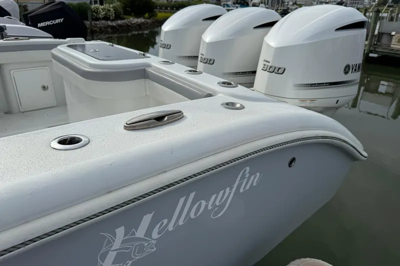 Slide: The Image of 2021 Yellowfin 36 Offshore boat with triple Yamaha engines docked at marina. - 22