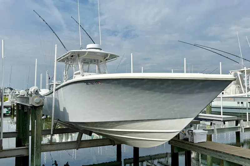 Slide: The Image of 2021 Yellowfin 36 Offshore boat with Yamaha 300 engines docked in marina. - 25
