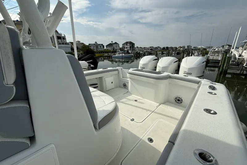 Slide: The Image of 2021 Yellowfin 36 Offshore boat with triple engines docked at marina. - 26