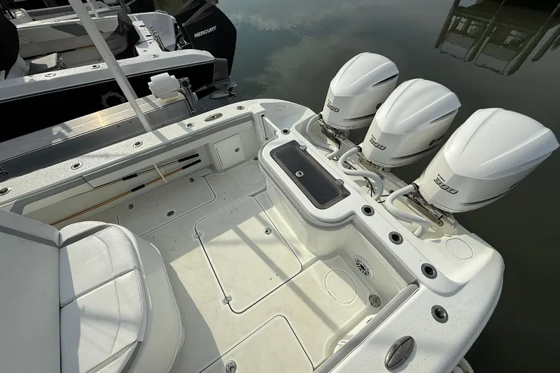 Slide: The Image of 2021 Yellowfin 36 Offshore boat at sunset, spacious deck, calm waters. - 6