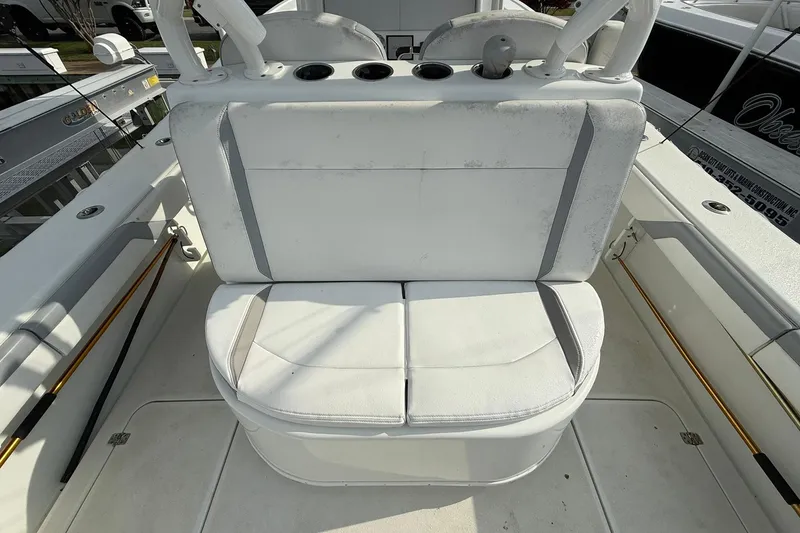 Slide: The Image of 2021 Yellowfin 36 Offshore boat at sunset, featuring triple engines and spacious deck. - 8