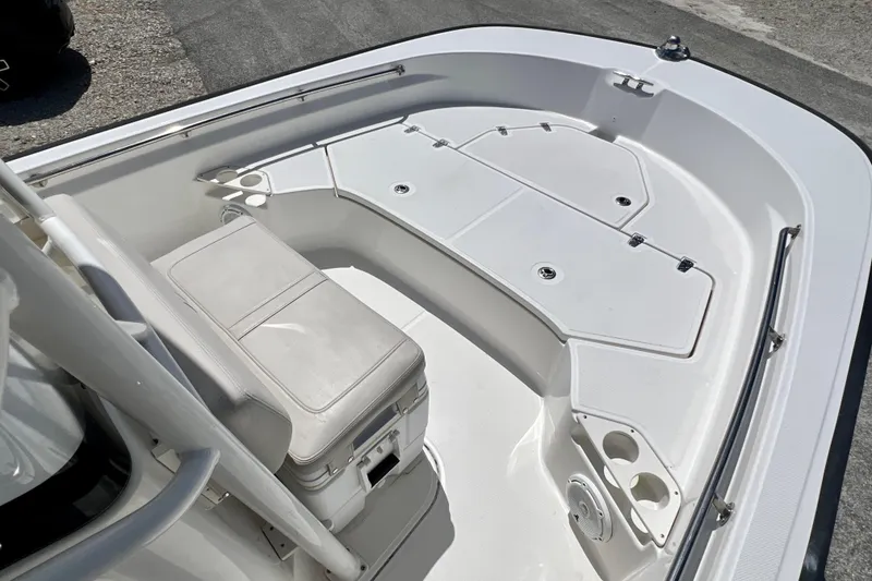 Slide: The Image of 2023 Boston Whaler 210 Montauk boat interior with seating and storage compartments. - 16