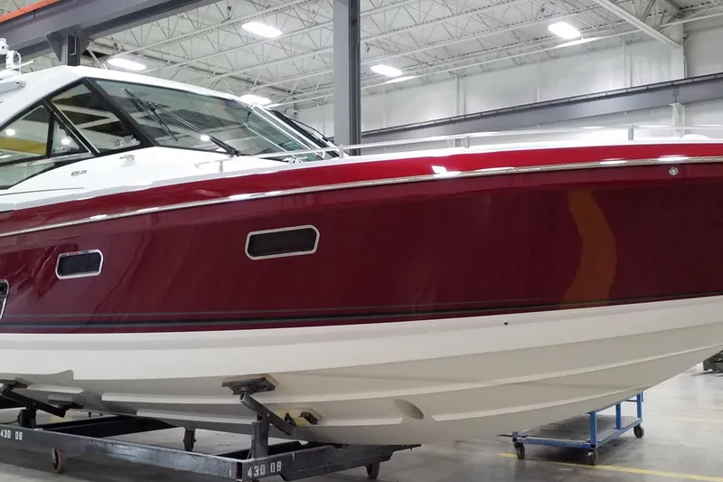 The Image of 2020 Formula 430 Super Sport Crossover yacht docked near modern buildings. - 0