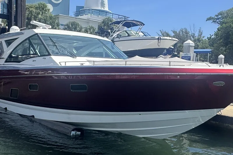Slide: The Image of 2020 Formula 430 Super Sport Crossover yacht on calm water, city skyline in background. - 7
