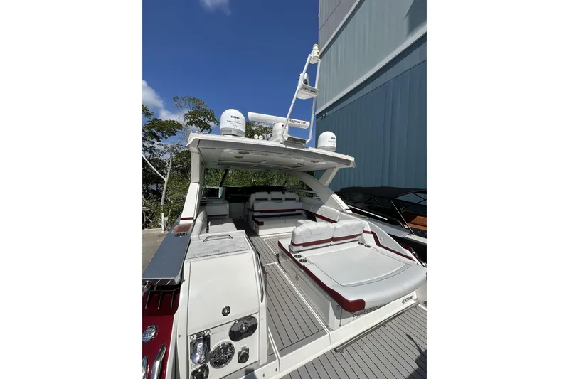 Slide: The Image of 2020 Formula 430 Super Sport Crossover cruising on open water, leaving a wake trail. - 8