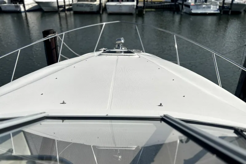 Slide: The Image of Bow view of 2001 Regal Commodore 2960 yacht docked at marina. - 11