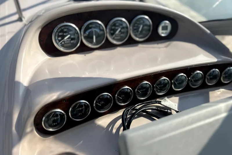 Slide: The Image of Dashboard of 2001 Regal Commodore 2960 boat with gauges and controls. - 16