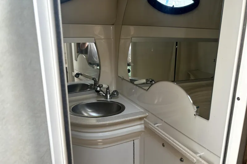 Slide: The Image of Bathroom interior of 2001 Regal Commodore 2960 boat with sink and mirror. - 27