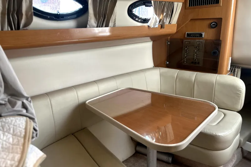 Slide: The Image of 2001 Regal Commodore 2960 interior with beige seating and wooden table. - 30