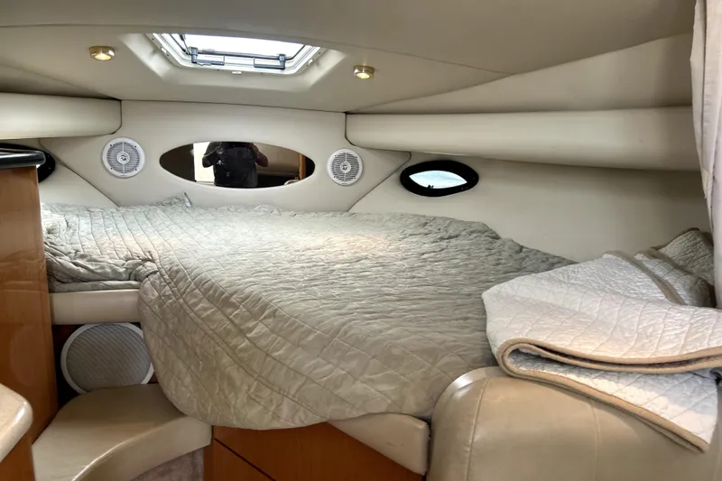 Slide: The Image of Interior cabin of 2001 Regal Commodore 2960 with cozy bed and porthole windows. - 31