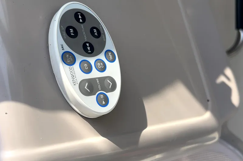 Slide: The Image of Kenwood audio control panel on 2001 Regal Commodore 2960 boat dashboard. - 35