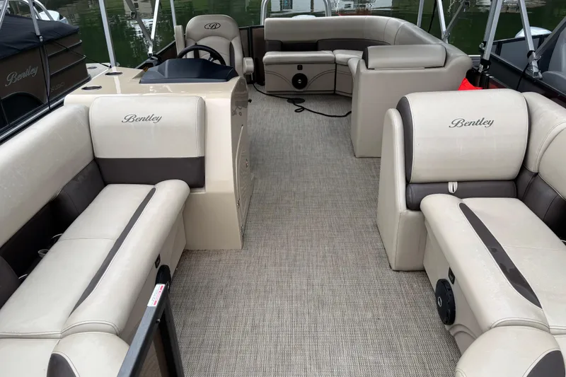 Slide: The Image of 2025 Bentley Pontoons 220 Cruise XL interior with luxurious seating and modern design. - 11