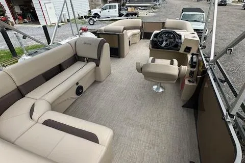 Slide: The Image of 2025 Bentley Pontoons 220 Cruise XL interior with beige and brown seating. - 2