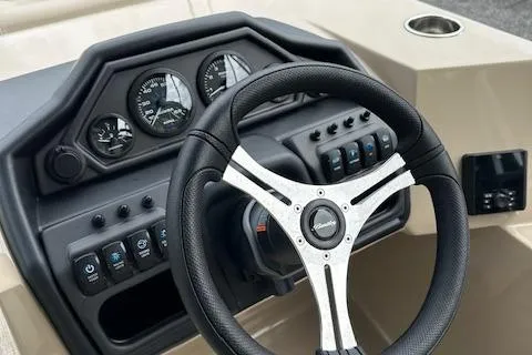 Slide: The Image of 2025 Bentley Pontoons 220 Cruise XL steering wheel and dashboard controls. - 3
