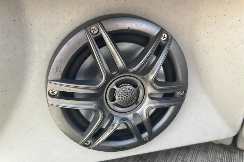 Slide: The Image of 2023 Harris Cruiser 230 boat interior with steering wheel and captain's chair. - 11