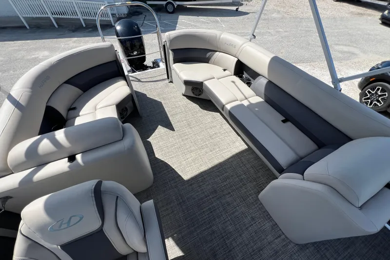 Slide: The Image of Control panel of 2023 Harris Cruiser 230 boat with ignition and switches. - 15