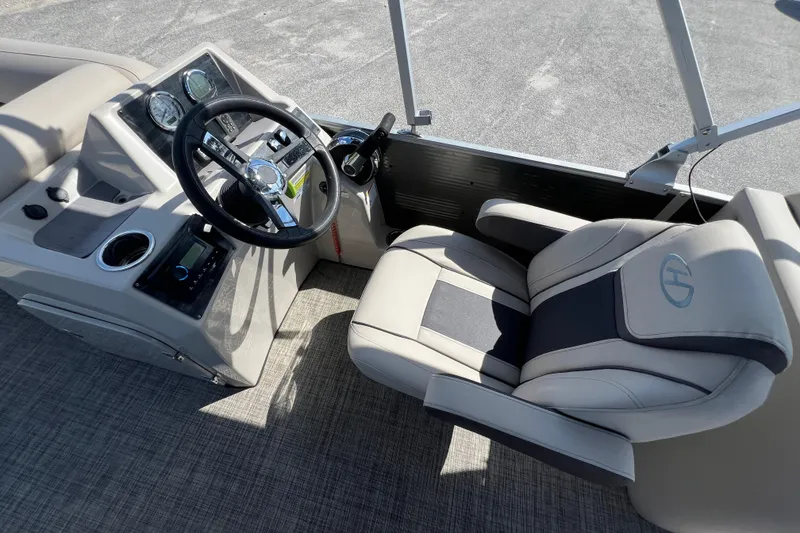 Slide: The Image of Control panel of 2023 Harris Cruiser 230 boat with throttle lever and switches. - 16