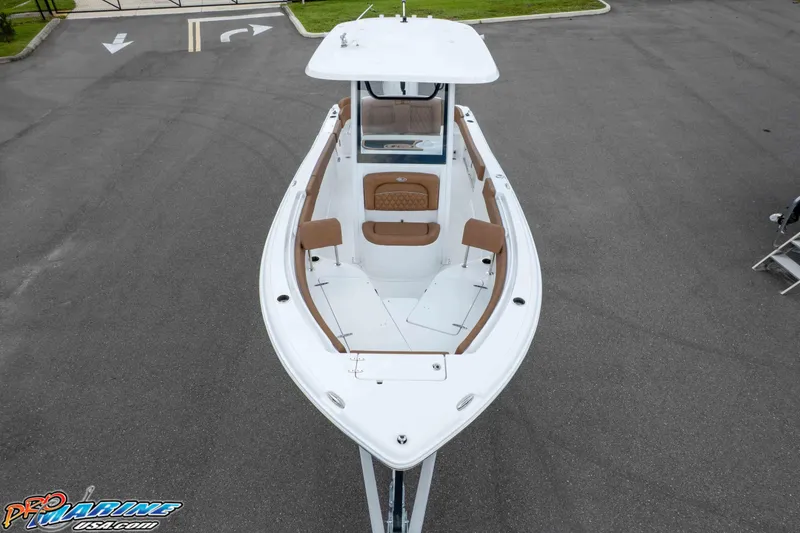 Slide: The Image of 2025 Sea Hunt Ultra 235 SE boat, aerial view, showcasing spacious deck and seating. - 13
