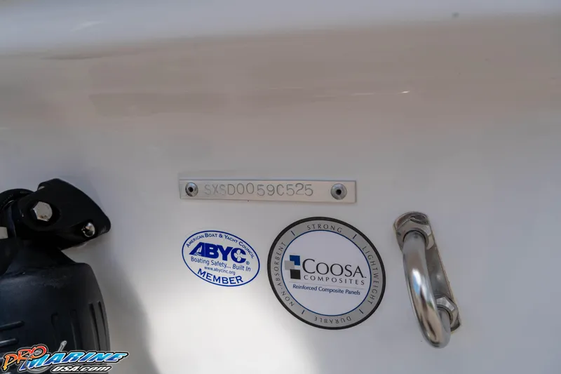 Slide: The Image of 2025 Sea Hunt Ultra 235 SE boat with ABYC and Coosa Composites labels. - 16