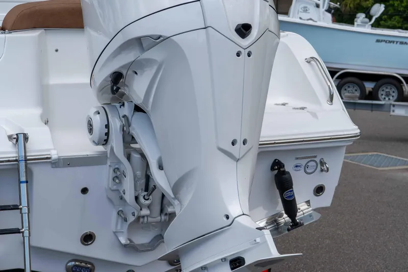 Slide: The Image of 2025 Sea Hunt Ultra 235 SE boat engine and stern view. - 26