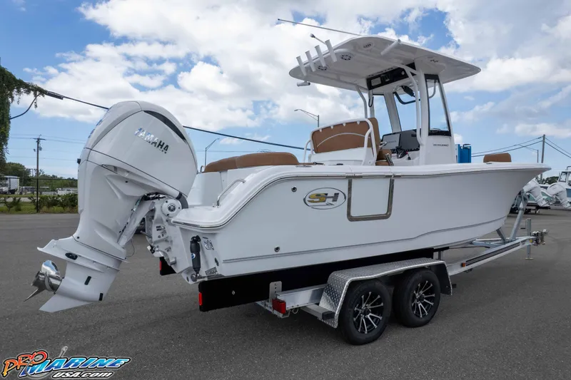 Slide: The Image of 2025 Sea Hunt Ultra 235 SE boat on trailer, featuring Yamaha outboard motor. - 5