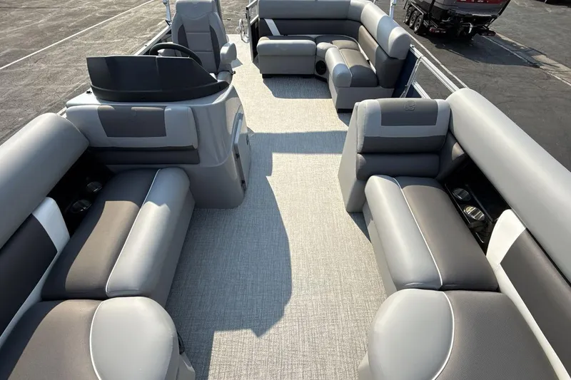 Slide: The Image of 2026 Landau Island Breeze 21 C pontoon boat interior with gray seating and spacious layout. - 12