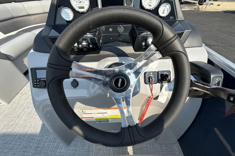 Slide: The Image of Steering wheel and dashboard of 2026 Landau Island Breeze 21 C pontoon boat. - 14