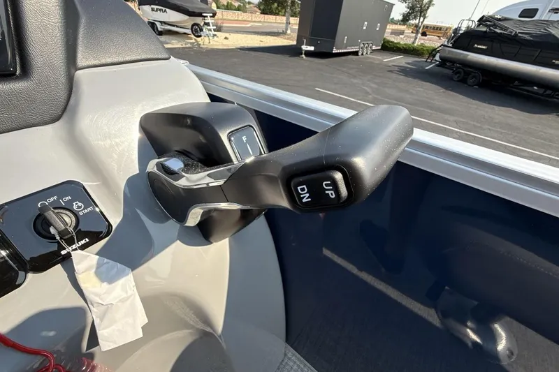 Slide: The Image of Control panel of 2026 Landau Island Breeze 21 C boat with throttle and ignition. - 16