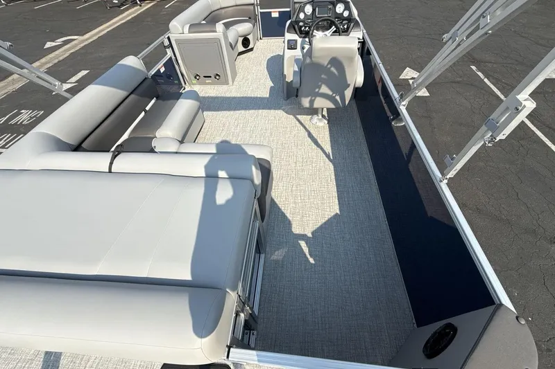 Slide: The Image of 2026 Landau Island Breeze 21 C pontoon boat interior with seating and helm. - 9