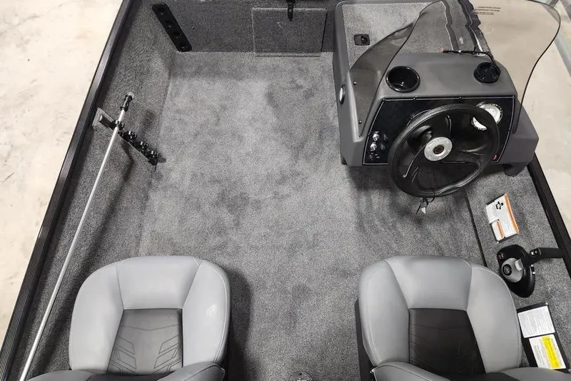 Slide: The Image of 2026 Tracker BASS TRACKER® Classic XL boat interior with steering console and seating. - 3