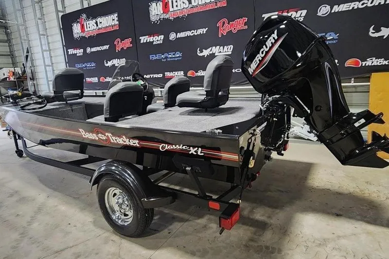Slide: The Image of 2026 Tracker BASS TRACKER® Classic XL boat with Mercury engine in showroom. - 4