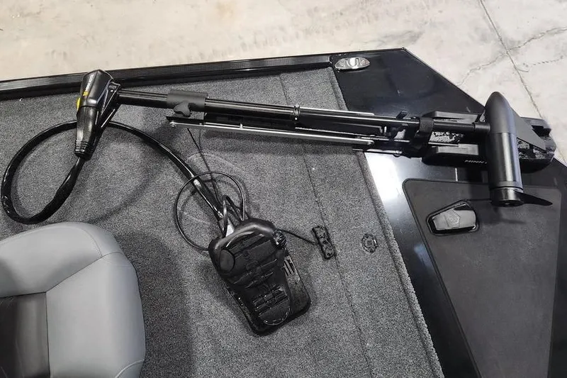 Slide: The Image of 2026 Tracker BASS TRACKER® Classic XL boat deck with trolling motor and foot pedal. - 5