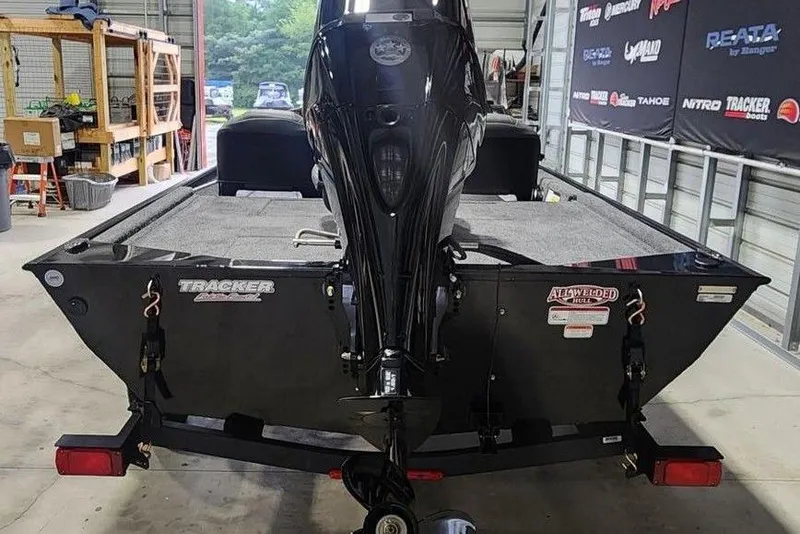 Slide: The Image of 2026 Tracker BASS TRACKER® Classic XL boat in a garage, rear view. - 6