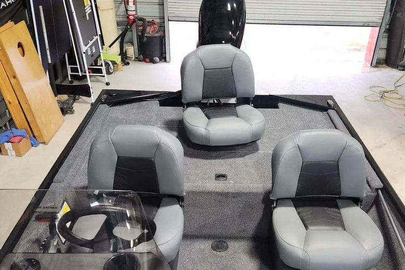 Slide: The Image of 2026 Tracker BASS TRACKER® Classic XL boat interior with three gray seats. - 9