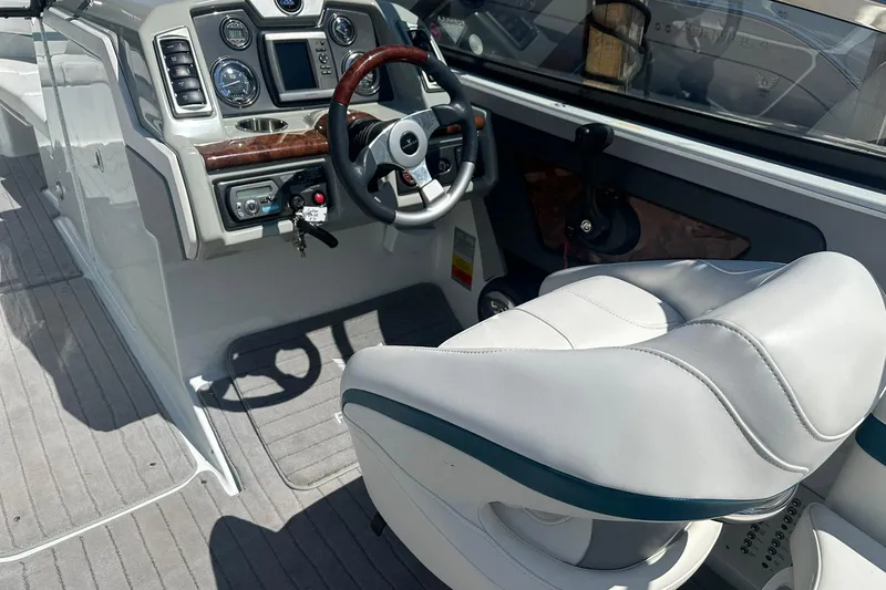 Slide: The Image of 2009 Formula 270 Bowrider cockpit with steering wheel and control panel. - 10