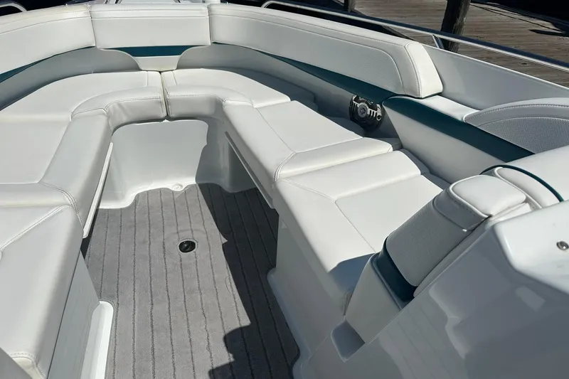 Slide: The Image of 2009 Formula 270 Bowrider interior with white seating and gray flooring. - 14