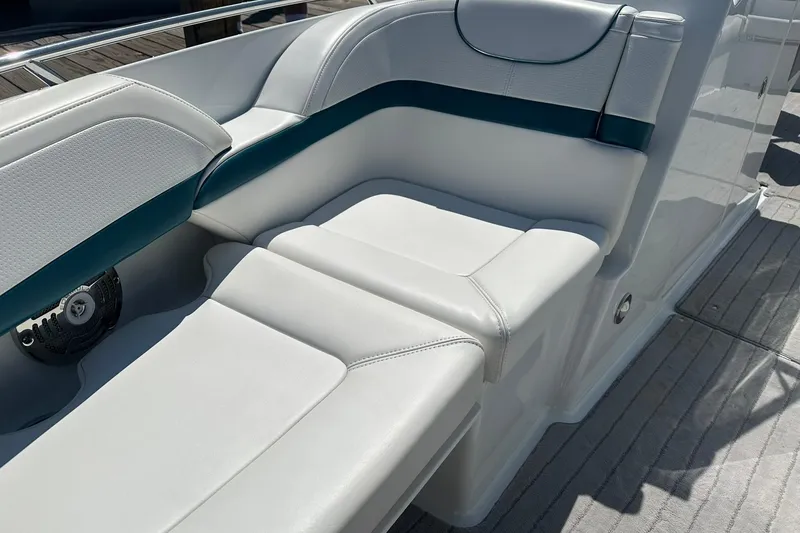 Slide: The Image of 2009 Formula 270 Bowrider boat interior with white and teal seating. - 16