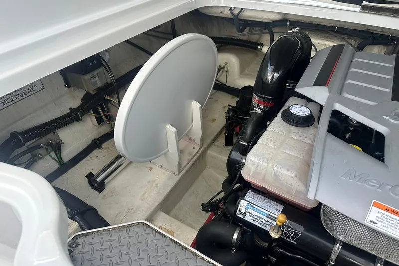 Slide: The Image of Engine compartment of a 2009 Formula 270 Bowrider boat, featuring a MerCruiser engine. - 22