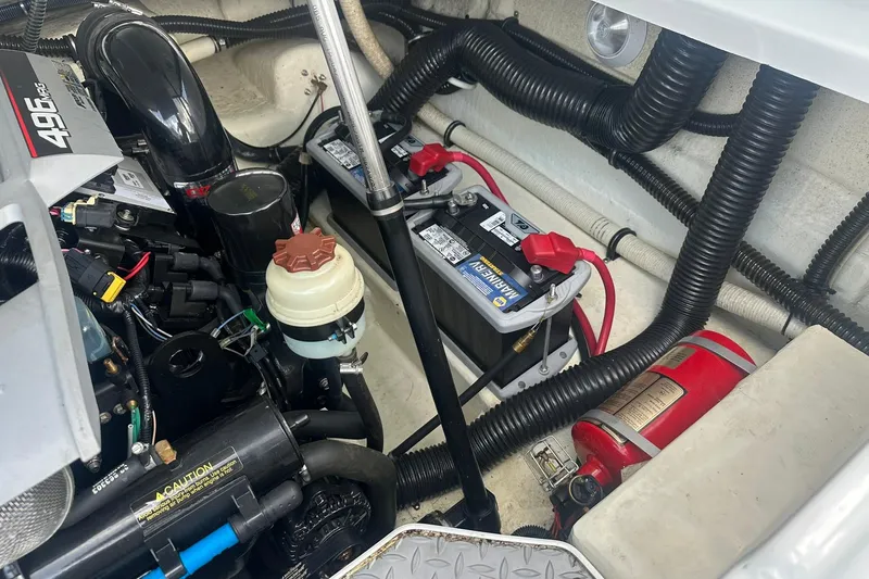 Slide: The Image of Engine compartment of a 2009 Formula 270 Bowrider with batteries and fire extinguisher. - 23